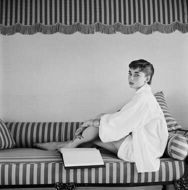 Audrey Hepburn in white shirt at home, photo by Mark Shaw