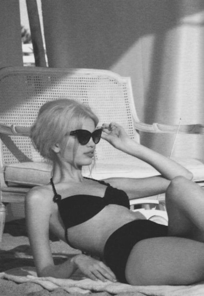 Elegant style icon wardrobe essentials: Brigitte Bardot in swimwear, a two piece bikini in black