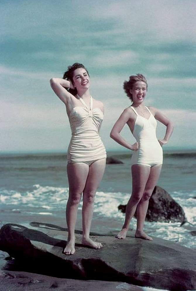 Elegant style icon wardrobe essentials: Elizabeth Taylor in swimwear, a white one piece swimsuit