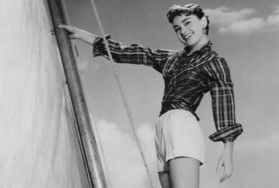  Elegant style icon wardrobe essentials: Audrey Hepburn in shorts, on the set of film Sabrina, 1954