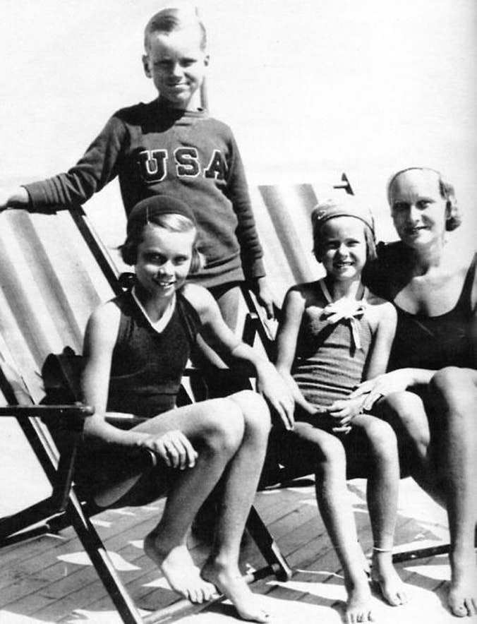 Elegant style icon wardrobe essentials: Grace Kelly in swimwear as a child with her mother and siblings