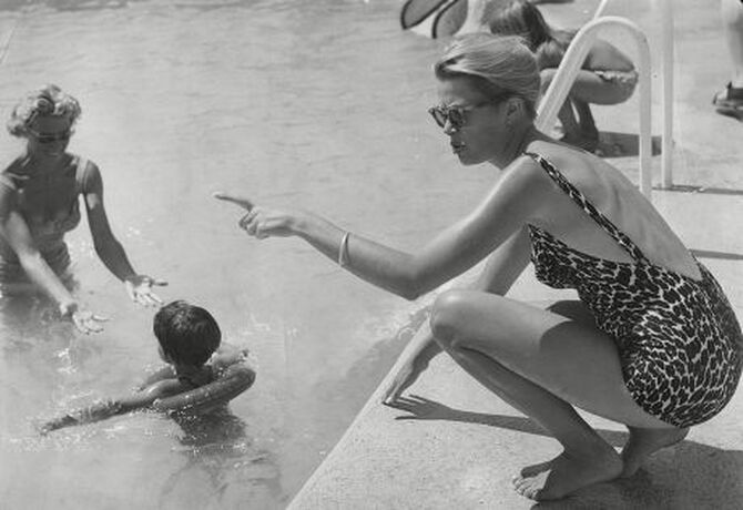 Elegant style icon wardrobe essentials: Grace Kelly in swimwear, a one piece printed swimming suit