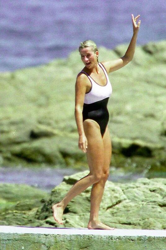 Elegant style icon wardrobe essentials: Princess Diana in swimwear, a one piece black white swimsuit