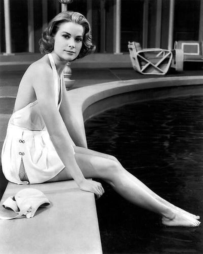 Elegant style icon wardrobe essentials: Grace Kelly in swimwear, a halter neck one piece swimming suit, in film High Society