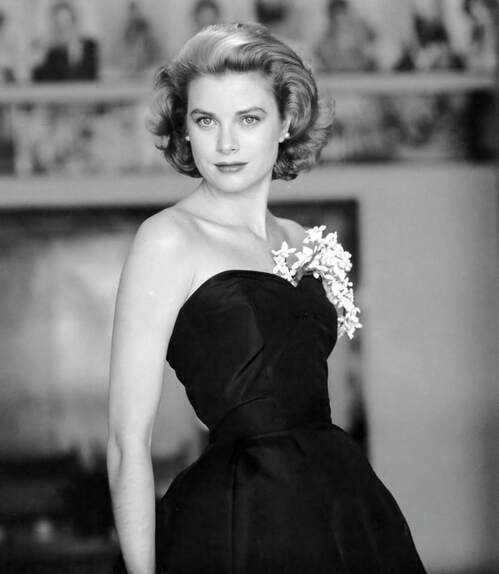 Elegant style icon wardrobe essentials: Grace Kelly in black dress, photo by Howell Conant, 1955