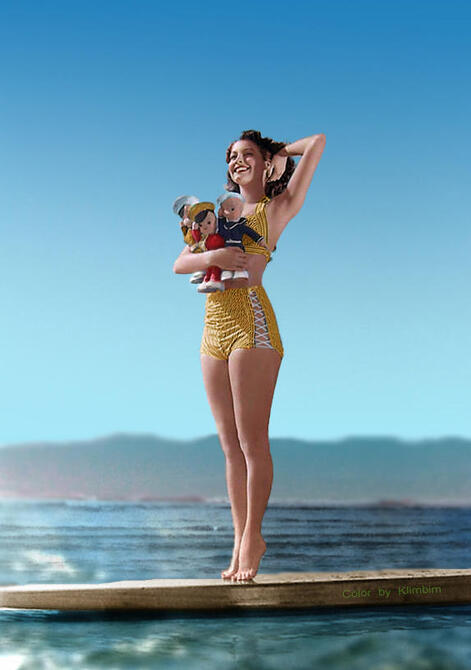 Elegant style icon wardrobe essentials: Ava Gardner in swimwear, a two piece bikini in print