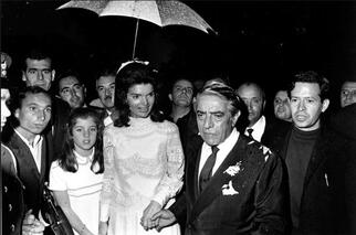 Jackie Kennedy Onassis on her wedding day with Aristotle Onassis in white wedding dress designed by Valentino Garavani