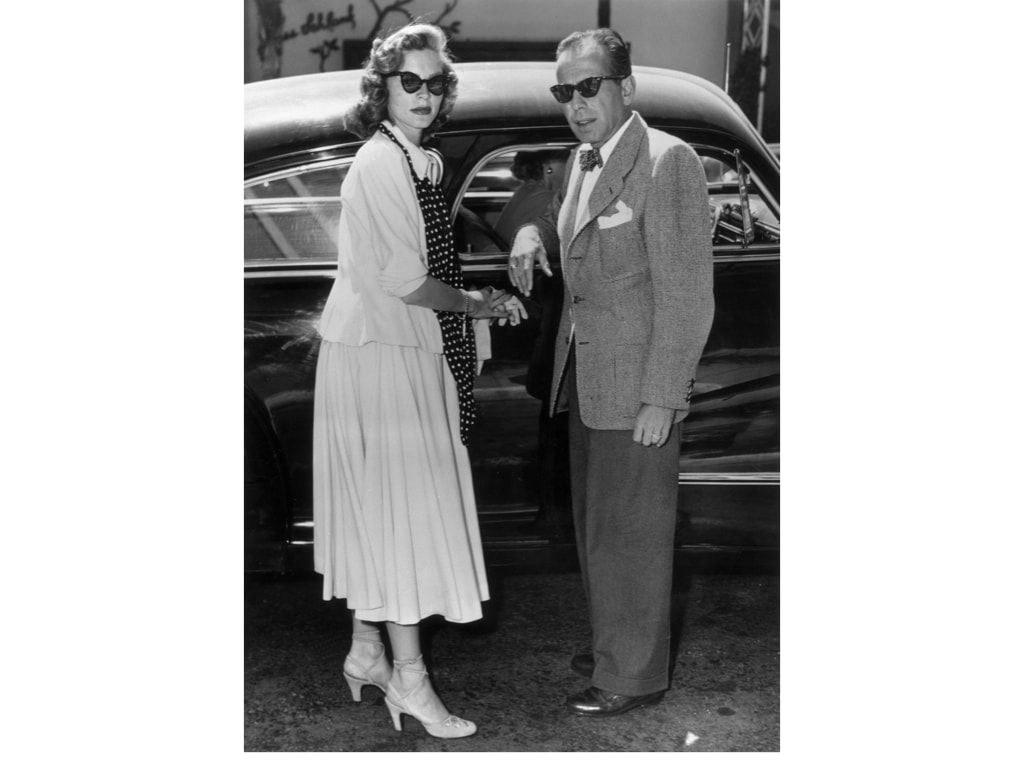 Elegant style icon wardrobe essentials: The Polka dot: Lauren Becall in polka dot silk scarf with Humphrey Bogart
