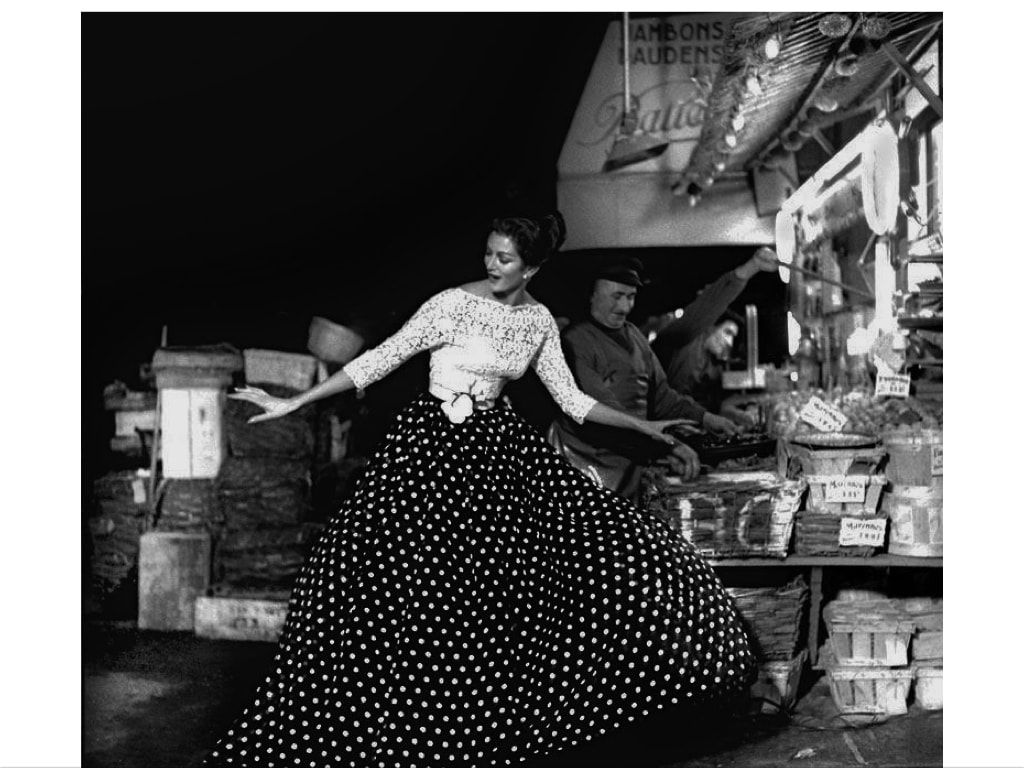 Elegant style icon wardrobe essentials: The Polka dot, model in silk polka dot dress in a fish market in France, April 1957, photo Gleb Derujinsky
