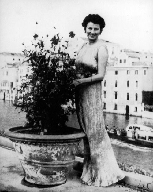 Peggy Guggenheim in her mariano fortuny Delphos gown on her Venice terrace, 1954