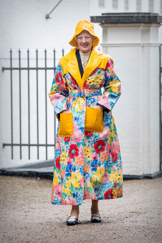 Queen Margrethe in a colorful raincoat designed by herself, 2017. Getty Images
