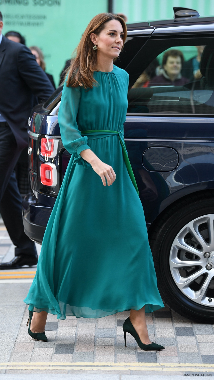Kate Middleton in Aross girl x soler ‘Amanda’ dress on October 2019 for visit to Aga Khan centre in London, a teal silk georgette dress featuring long blouson sleeves that tie at the cuffs.
