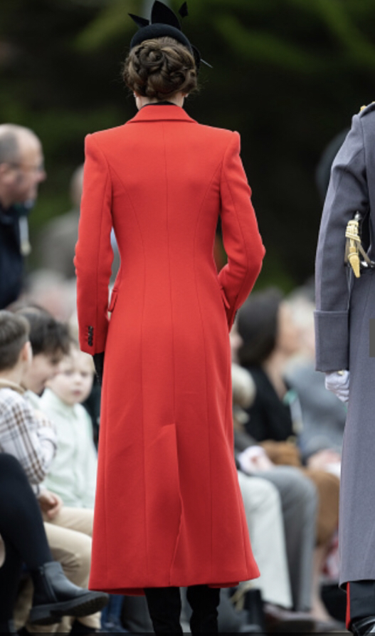 Kate Middleton in custom made red Alexander McQueen double-breast midi coat, 1 March 2023. Getty Images