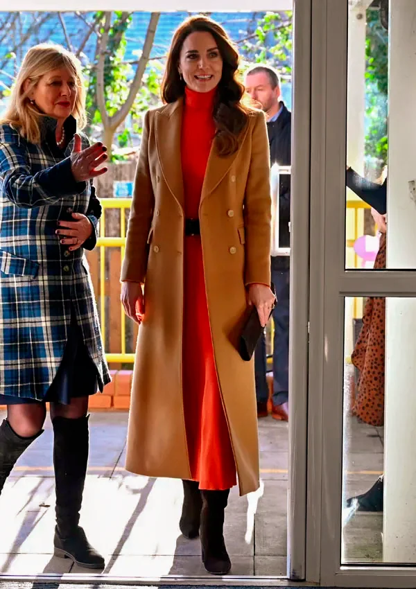 Kate Middleton in Massimo Dutti brown cashmere wool coat and Gabriela Hearst orange sweater skirt set, 18 Jan 2023. Getty Images