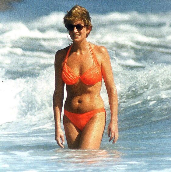 Elegant style icon wardrobe essentials: Princess Diana in swimwear, a two piece halter neck coral bikini
