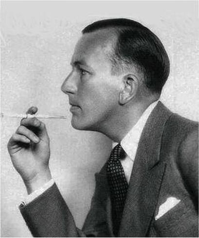 Noel Coward with cigarette holder in 1930