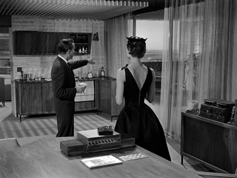 Elegant style icon wardrobe essentials: Audrey Hepburn in little black dress in film Sabrina(1954)