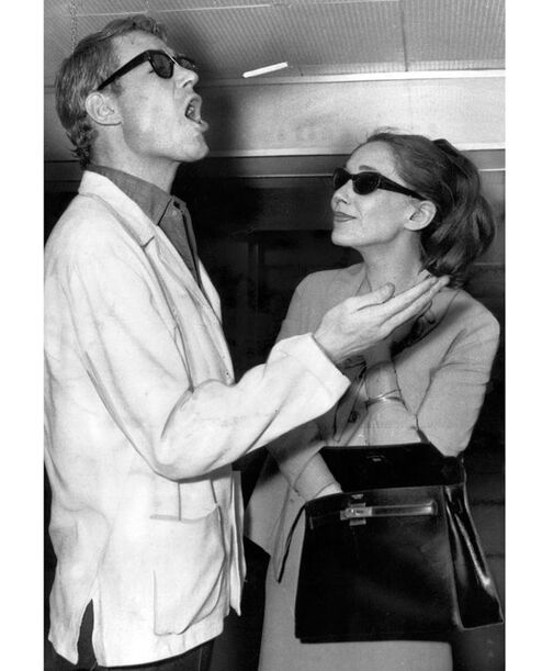 Peter O'toole with Audrey Hepburn, flicking a cigarette on his way of flying to Italy