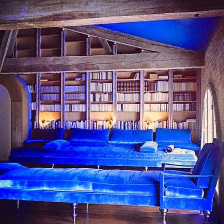 The blue velvet lounge chairs in library of Chateau de Moutou