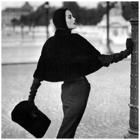 Anne St Marie Wearing a seal skin slip cover cape by Pierre Balmain, Photo by Henry Clarke,1955 for Vogue
