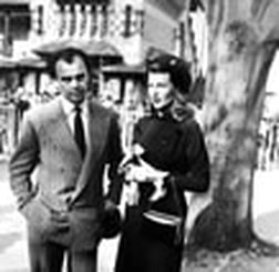 Aly Khan with Rita Hayworth in striped suit
