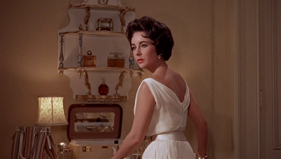 Elizabeth Taylor in film Cat on a Tin Roof( 1958), wearing a white chiffon dress designed by Helen Rose