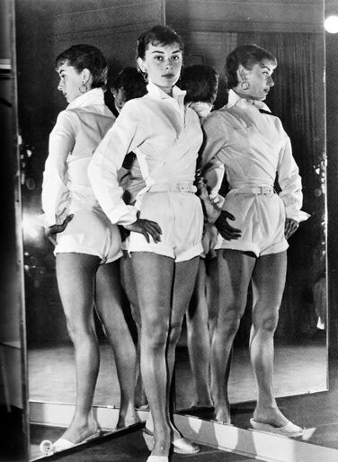 Audrey Hepburn in white shirt during Sabrina production, 1953