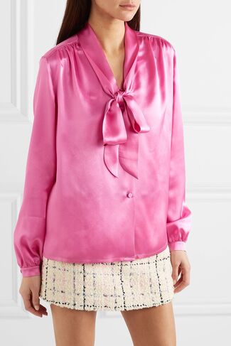 Gucci pink pussy-bow silk-satin blouse with buttons positioned front and different shoulder seam and sleeve cuff treatment than the Kate Middleton purple silk blouse