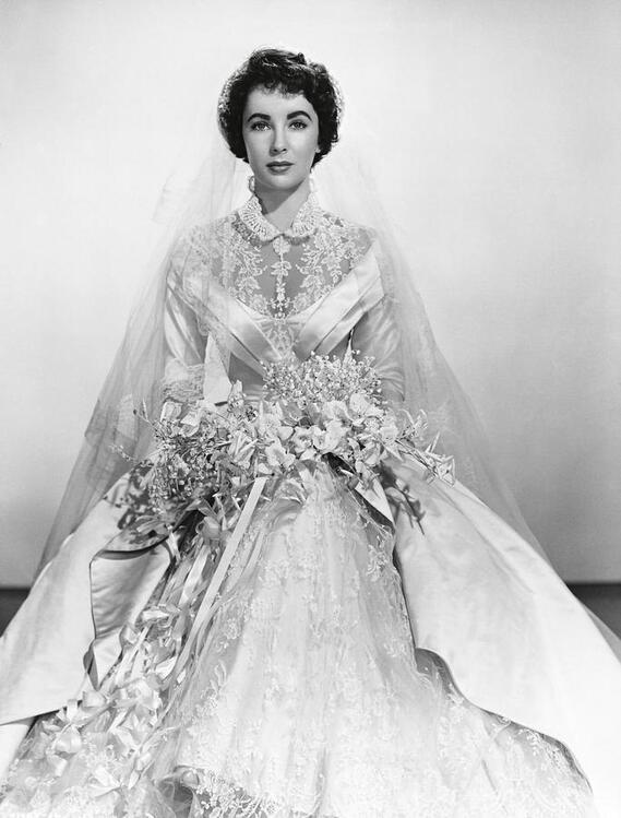 Elizabeth Taylor wearing wedding gown designed by Helen Rose, publicity photo for film Father of the Bride(1950) 