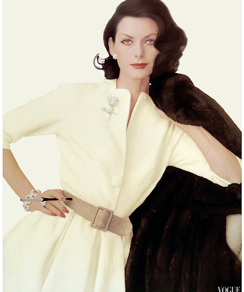 Anne Sainte Marie in Hannah Troys white wool dress, Vogue Aug 1959, photo by John Rawlings