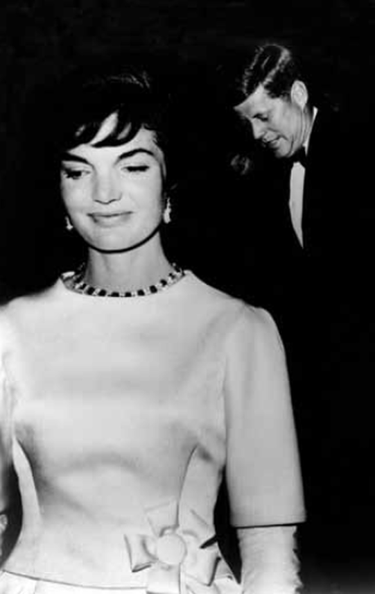 Jackie Kennedy in a silk floor length gown, with her husband John F. Kennedy, at Pre-Inauguration Gala held at National Guard Armory in Washington, D.C. on 19 January 1961