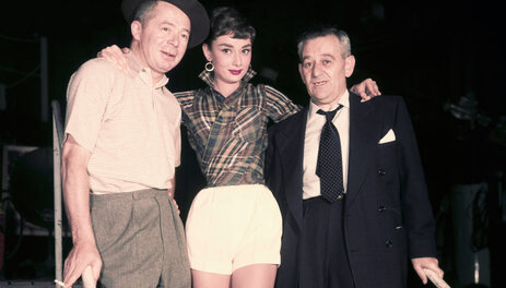 Elegant style icon wardrobe essentials: Audrey Hepburn in shorts on the set of film Sabrina, 1954