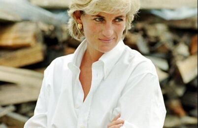 Princess Diana in white shirt blue jeans and loafers
