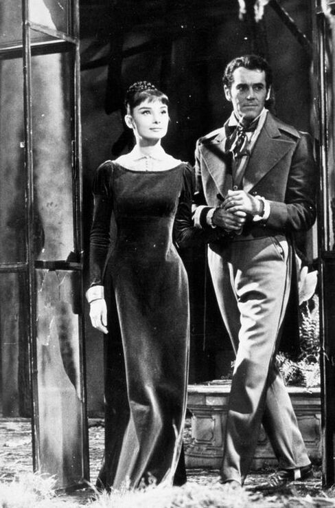 Elegant style icon wardrobe essentials: Audrey Hepburn in little black dress in film War and Peace(1956)
