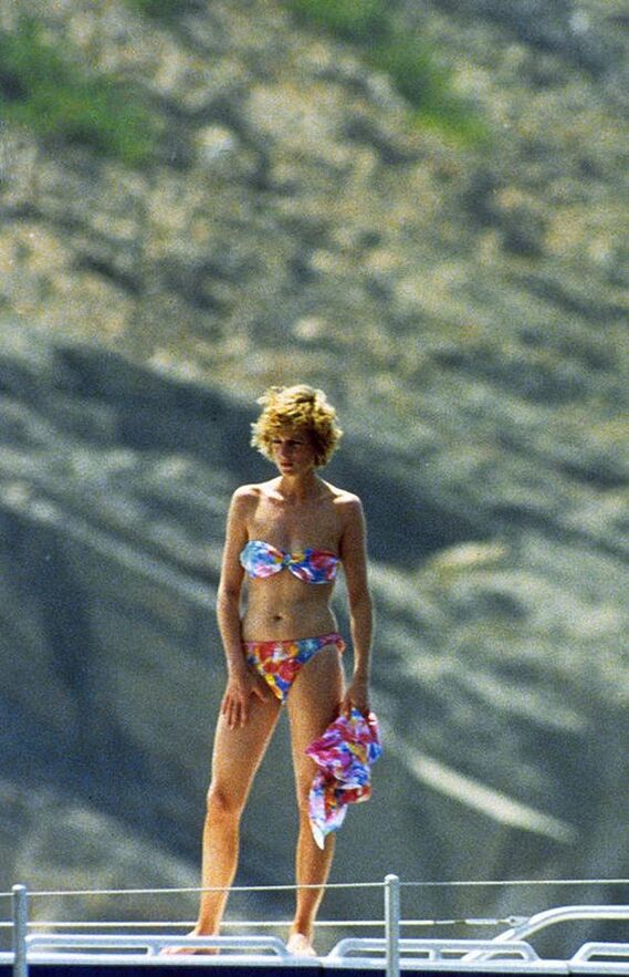 Elegant style icon wardrobe essentials: Princess Diana in swimwear, a two piece strapless bikini with floral print