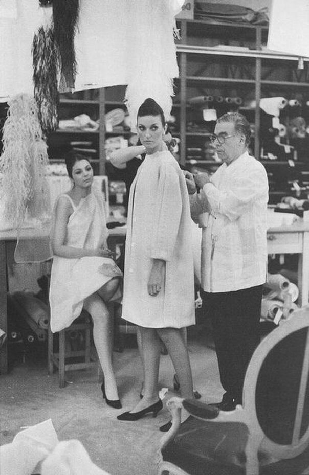 Cristobal Balenciaga working in his Paris studio with model, 1968