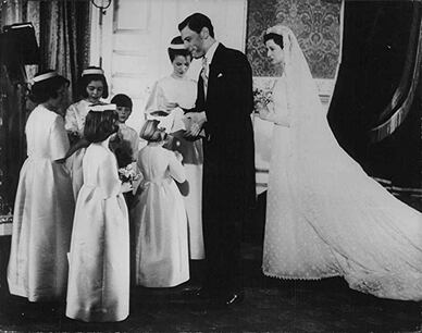 Princess Alexandra of Kent and Angus Ogilvy on their wedding with the flower girls, 24 April 1963, wearing the all lace wedding gown Westmin