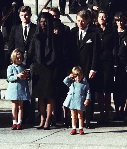 ohn F. Kennedy Jr. salutes to his father on his Funeral, 1963