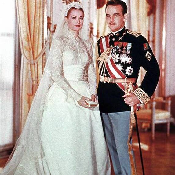 Grace Kelly on her wedding day with Prince Rainier, wearing bridal gown designed by Helen Rose, April 19, 1956