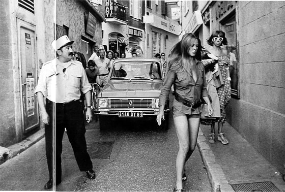 Elegant style icon wardrobe essentials: Brigitte Bardot in shorts, 1975