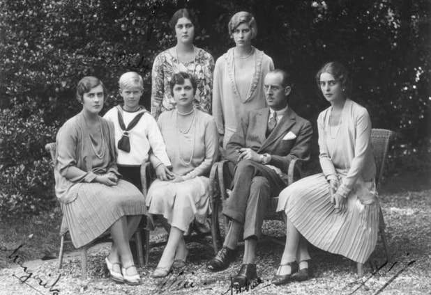 Prince Philip and his family: Front row: His sister Princess Margarita, him(standing), his mother Princess Alice and father Prince Andrew, his sister Princess Sophie; Second row standing: his sisters Princess Theodora(left)  and Princess Cecilie(right). 1930