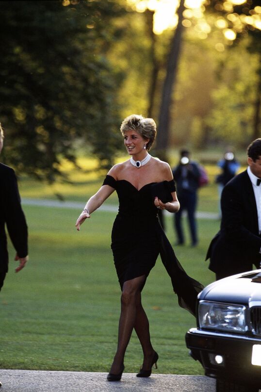 Elegant style icon wardrobe essentials: The Little Black Dress: Princess Diana in black dress designed by Christina Stambolian, the Revenge dress, June 1994