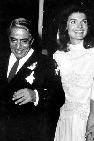 Jackie Kennedy Onassis on her wedding day with Aristotle Onassis in white wedding dress designed by Valentino Garavani