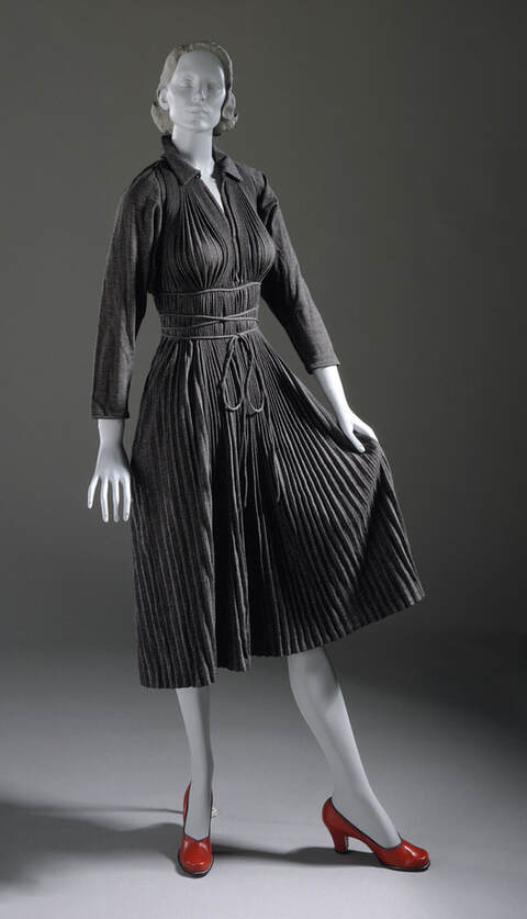 Black Monastic dress with spaghetti ties designed by Claire McCardell