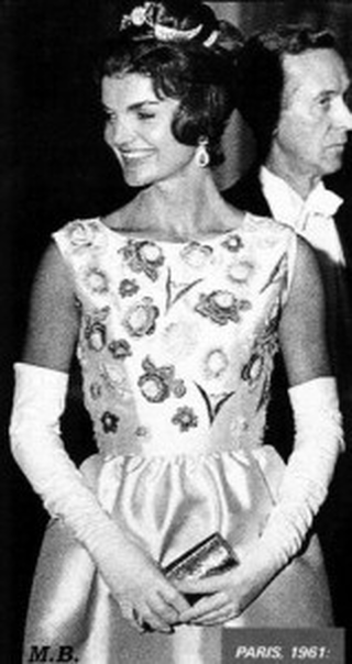 Jackie Kennedy wearing ivory Silk ziberline evening gown designed by Hubert de Givenchy for the state visit dinner in Versailles France, 1 June 1961