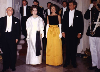 Jackie Kennedy wearing black silk velvet and Chinese yellow silk santon evening dress for White House state dinner honouring President Manuel Prato of Peru, 19 September 1961