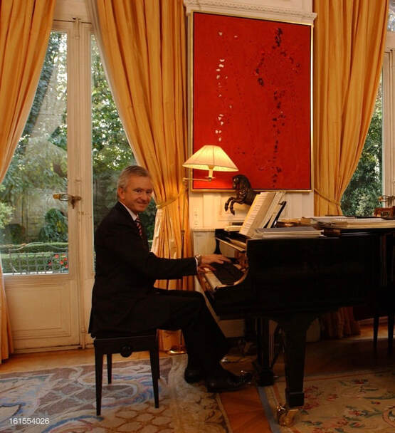 Bernard Arnault playing piano at his home in Paris