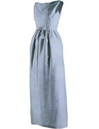 Pale blue sleeveless silk shantung eveningi dress Jackie Kennedy wore for dinner hosted by Queen Elizabeth II on her state visit to England, Buckingham Palace London, 5 June 1961, designed by Chez Ninon, featuring decorative bow on belt and soft pleats on skirt