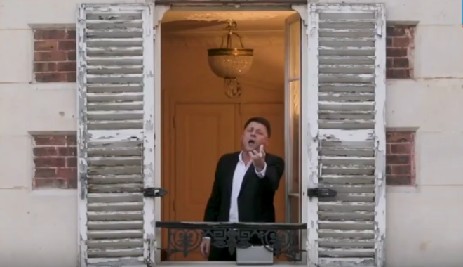 French opera singer Stéphane Sénéchal singing for his neighbours from his windows in Paris