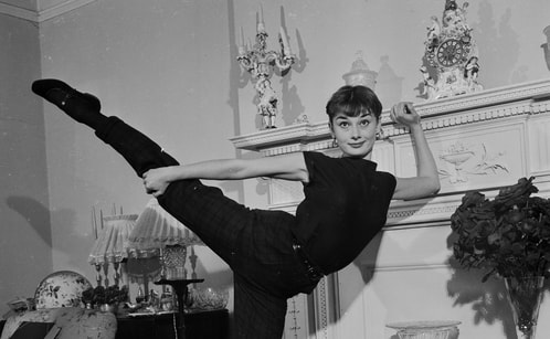 Audrey Hepburn at home in London 1951 doing exercise